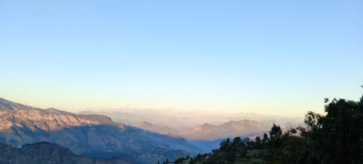 Luxury property elevation with landscape views